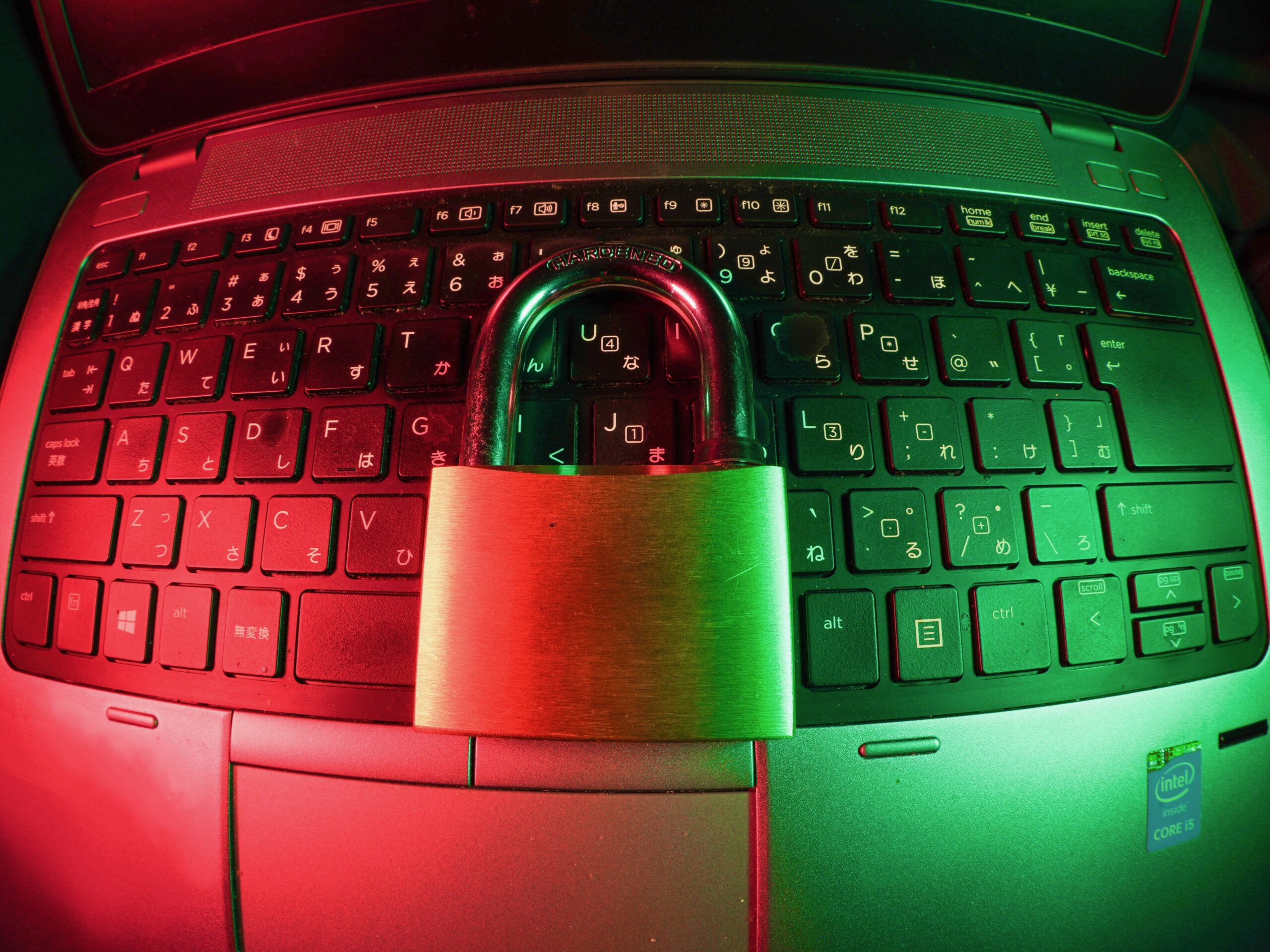 Photo of a lock sitting on top of a keyboard.